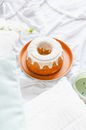 Brown and White Donut on Brown Round Plate