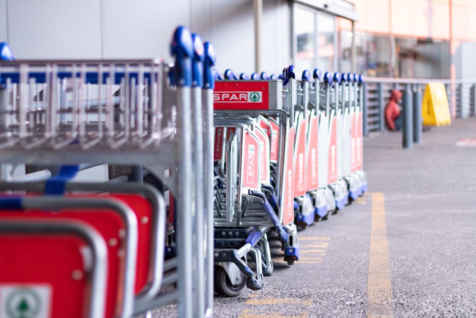 Row of trolleys outside a store in Johannesburg, South Africa, ready for shopper use.