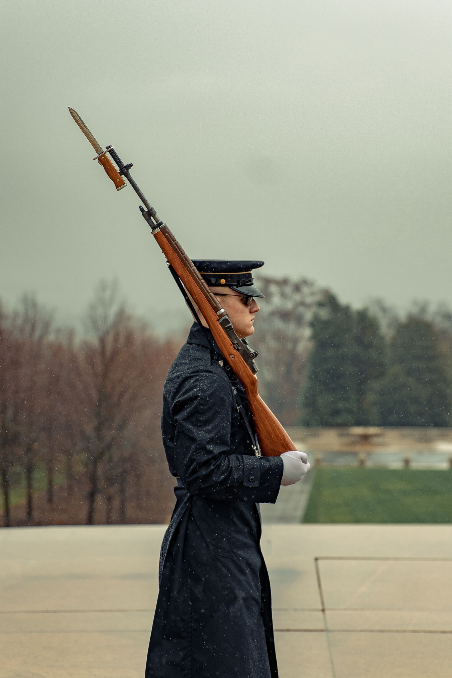 Marching Rifle Serious soldier with rifle on shoulder marching in park · Free Stock Photo