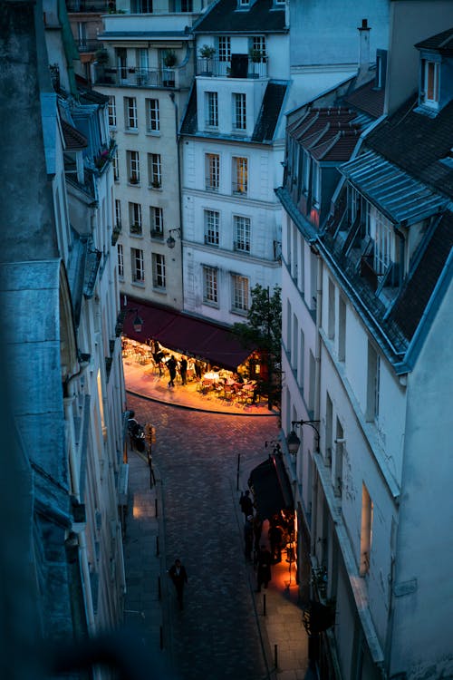 Evening street with outdoor cafe in Paris · Free Stock Photo