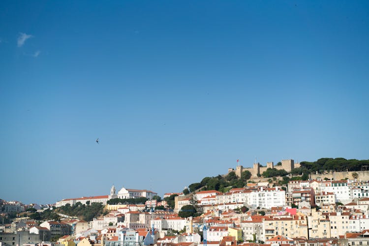 Scenic Cityscape Of Lisbon Under Blue Summer Sky