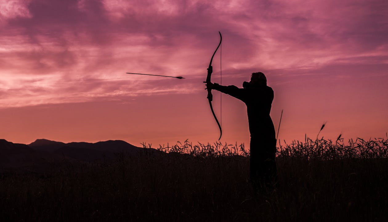 Person Shooting Arrow from Bow