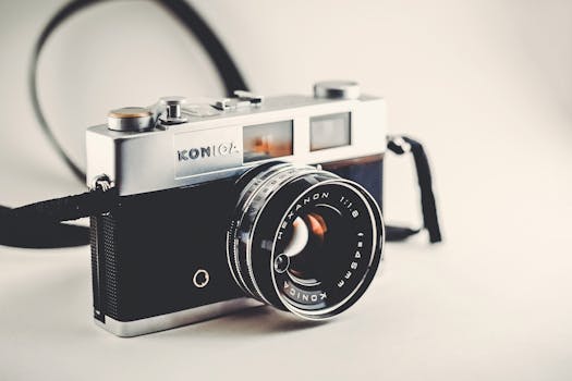 Vintage Konica camera with a sleek, classic design and lens details.