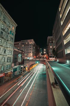 Captivating long exposure night shot in Stockton, CA with vibrant street light trails.