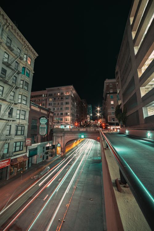 Free Captivating long exposure night shot in Stockton, CA with vibrant street light trails. Stock Photo