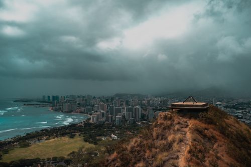 Free Aerial view of Honolulu skyline from a mountaintop under a dramatic stormy sky. Stock Photo
