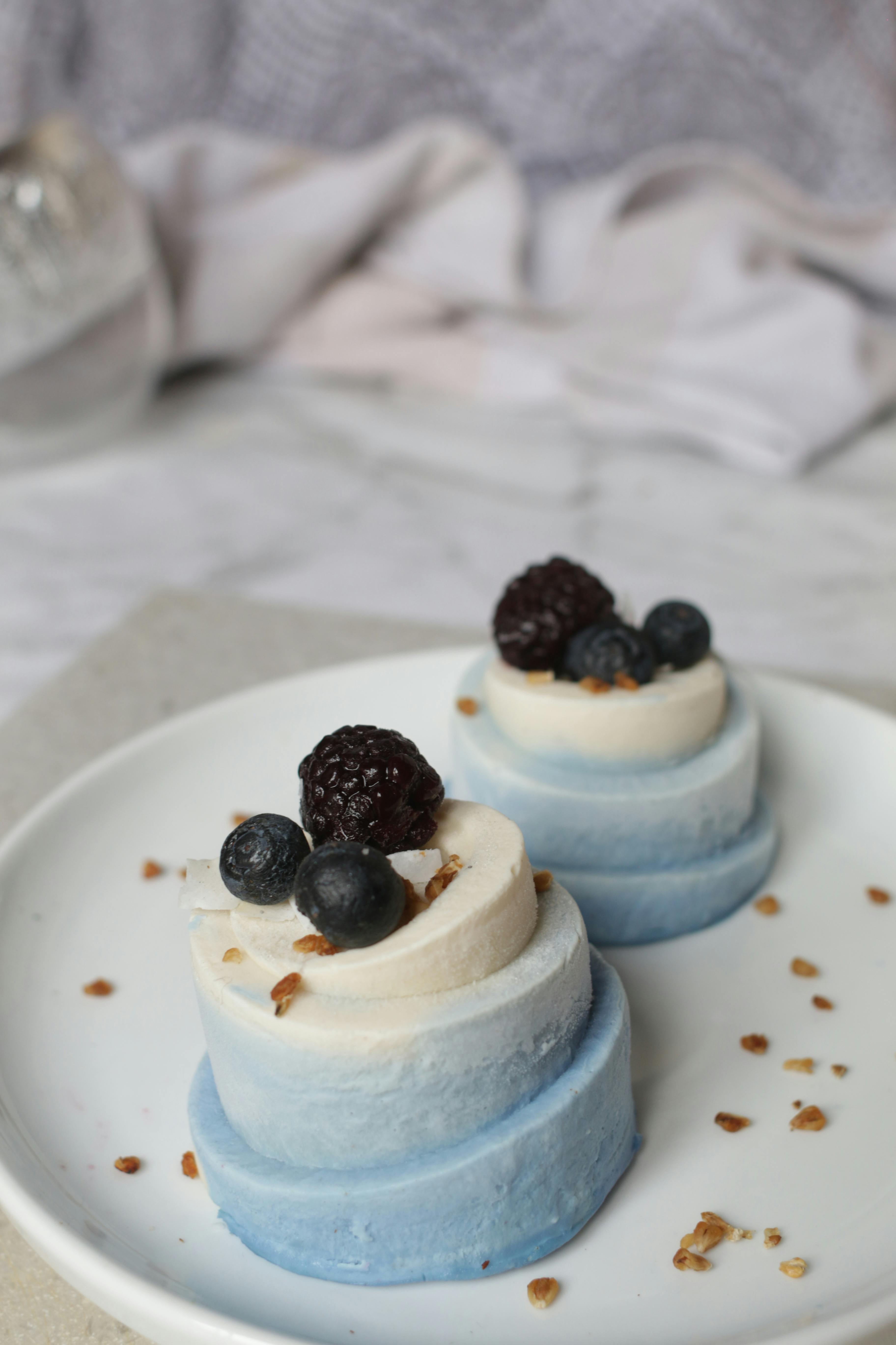 Elegant vegan cheesecake with blackberries and blueberries. Perfect for dessert lovers.