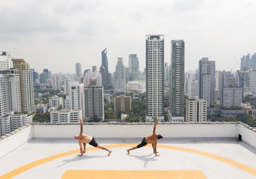 Photo Two Men Doing Yoga