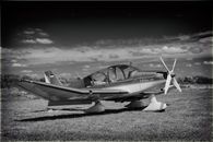 Black and White Aviation Plane Arriving during Sunset · Free Stock Photo