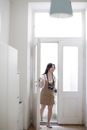 Happy Asian photographer returning home