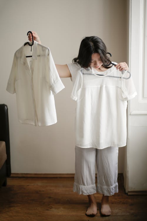Young Asian woman choosing clothes