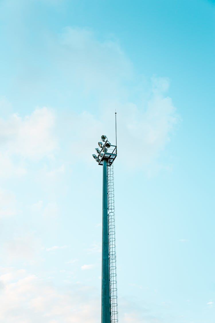 Tall Tower With Spotlights In Sky