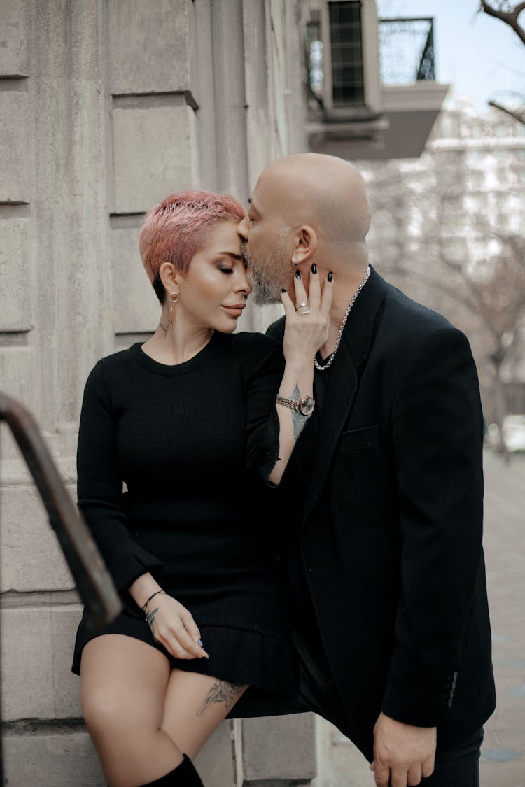 Elegant Couple In Love Kissing On Street