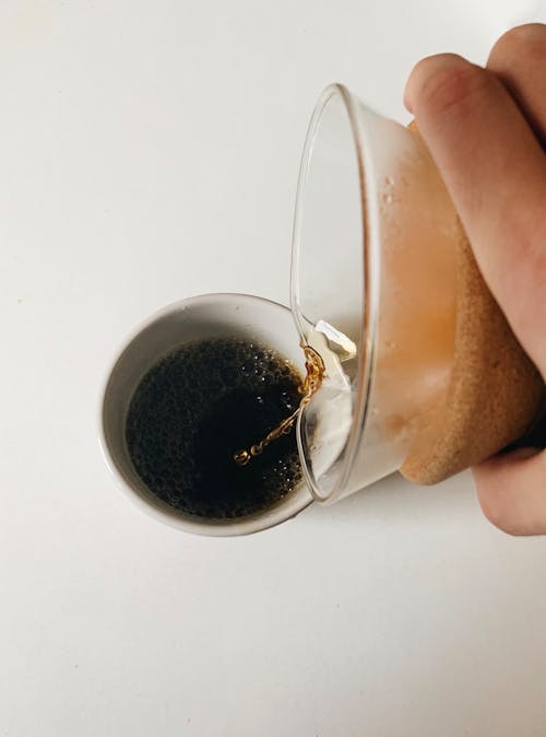 Clear Drinking Glass With Brown Liquid