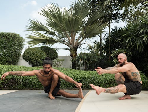 Photo of Two Men Exercising