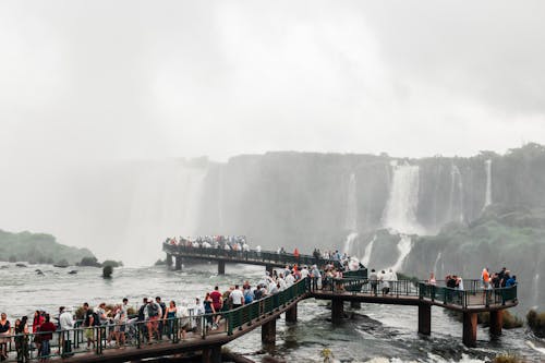 People on the Bridge Near Water Falls