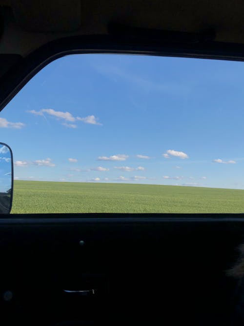 Безкоштовне стокове фото на тему «автомобіль, вікно, небо»