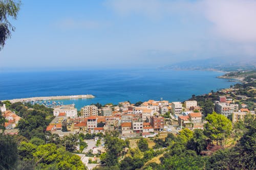 Coastal town on picturesque seashore in summer day