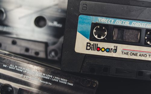 Free A nostalgic close-up of vintage audio cassette tapes, evoking memories of analog music and retro technology. Stock Photo
