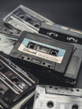 Collection of classic audio cassettes with vintage labels, evoking nostalgia and retro vibes.