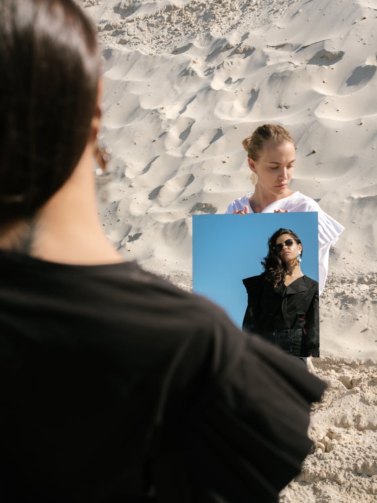 Young Female Rivals With Mirror On Sandy Beach Under Sunlight