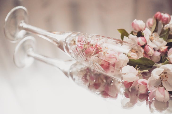 Bouquet of fresh cherry flowers in fallen glass