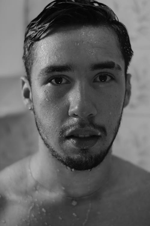 Black and White Photo of Man's Wet Face