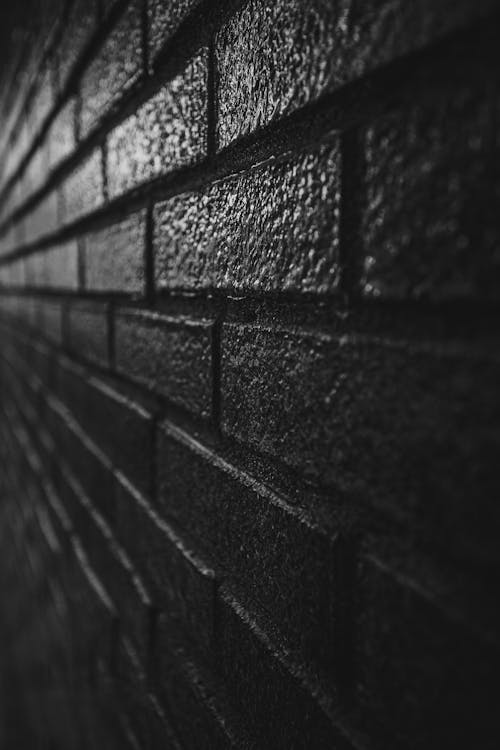 Free Dark brick wall outside modern building Stock Photo