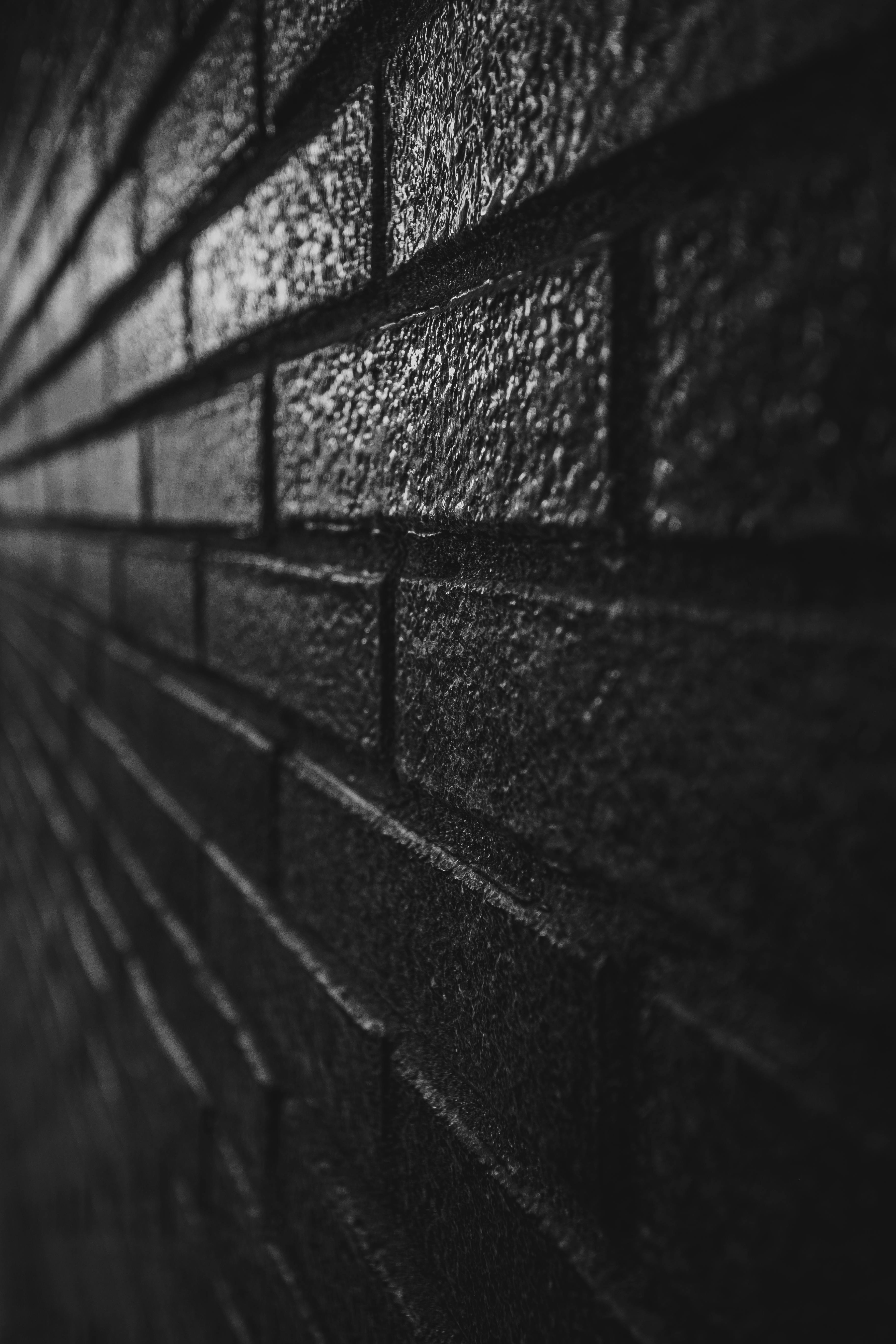 Dark brick wall outside modern building · Free Stock Photo