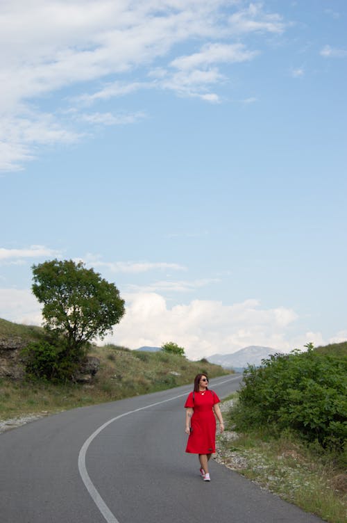 Free stock photo of asphalt road, blue mountains, clouds