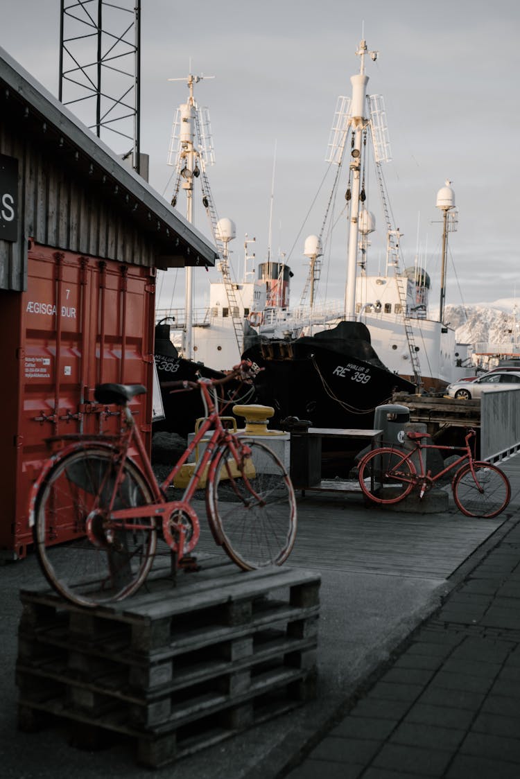 Bicycle On Shabby Wooden Pallet In Harbor