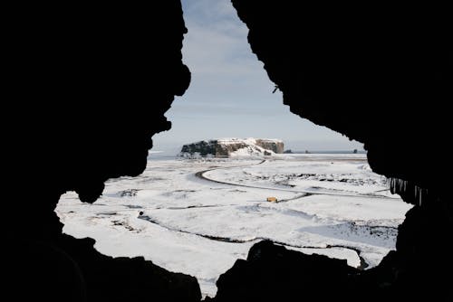 Beautiful winter landscape from inside of natural cave on hill top in Dryholaus nature preserve