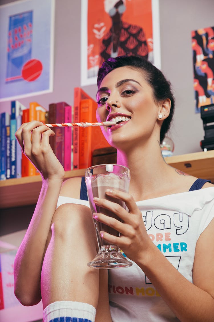 Joyful Woman Enjoying Chocolate Milkshake At Home