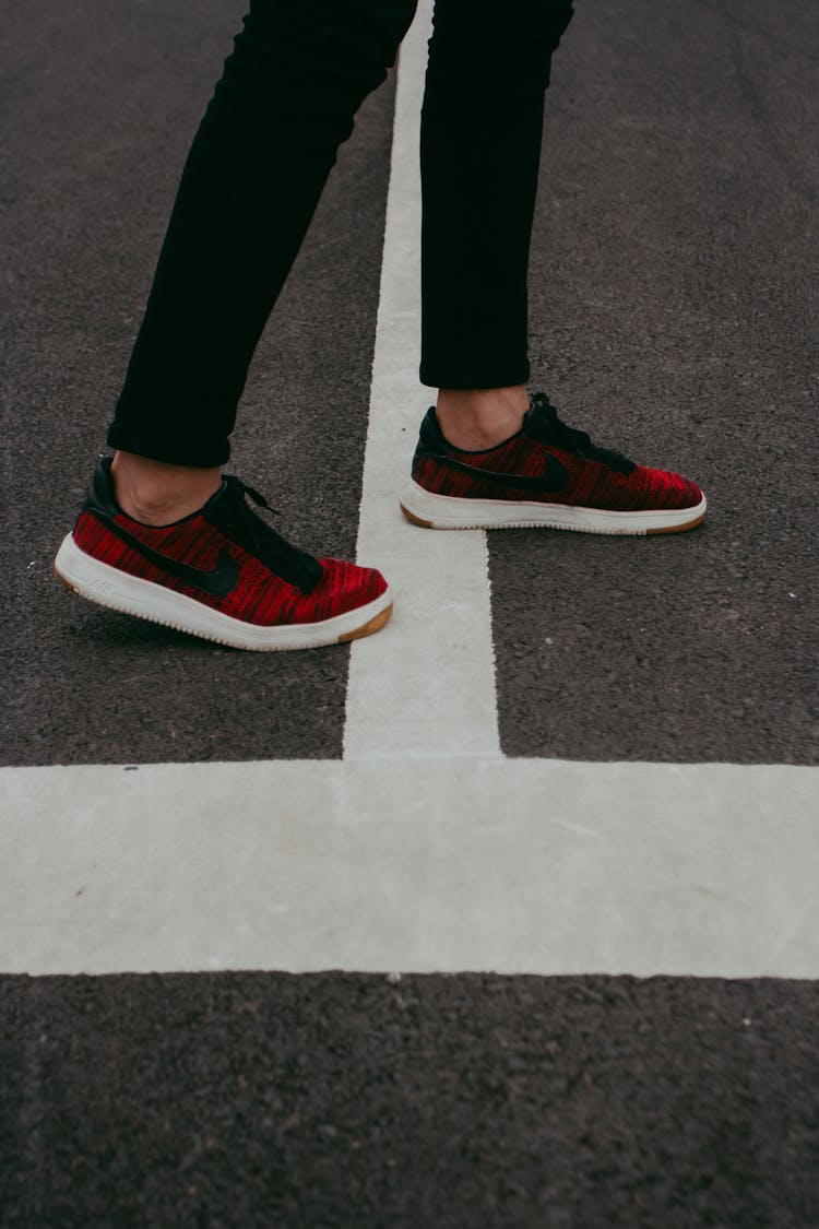 Person Standing On A White Line