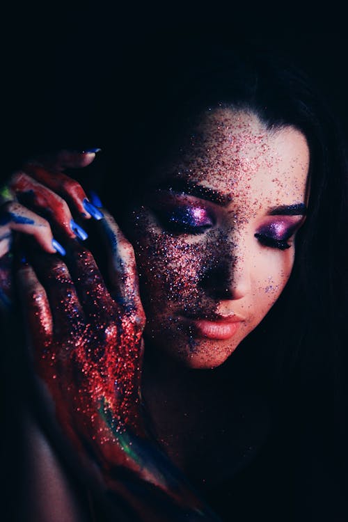 Sensual woman with bright glitter makeup