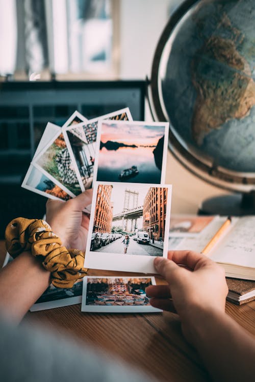 Person Holding White Printer Paper