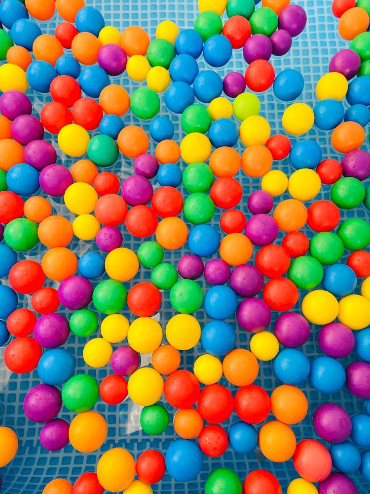 Colorful Plastic Balls Floating In The Water