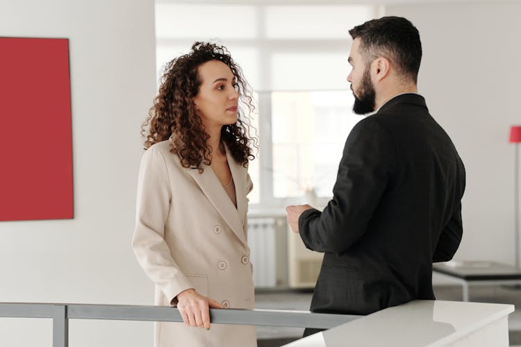 Man And Woman Talking In Office