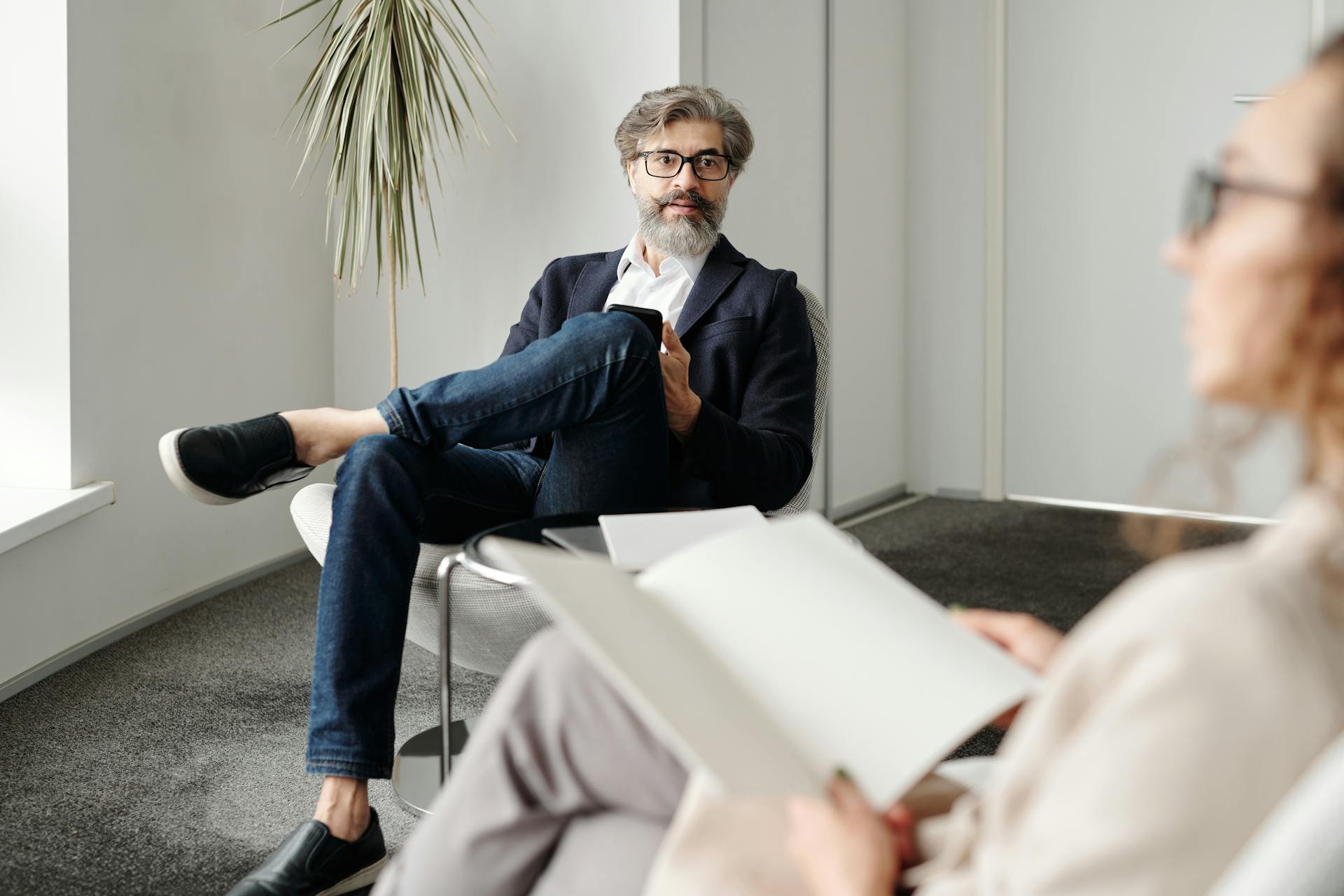 Man and Woman Talking in Office