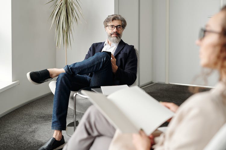 Man And Woman Talking In Office