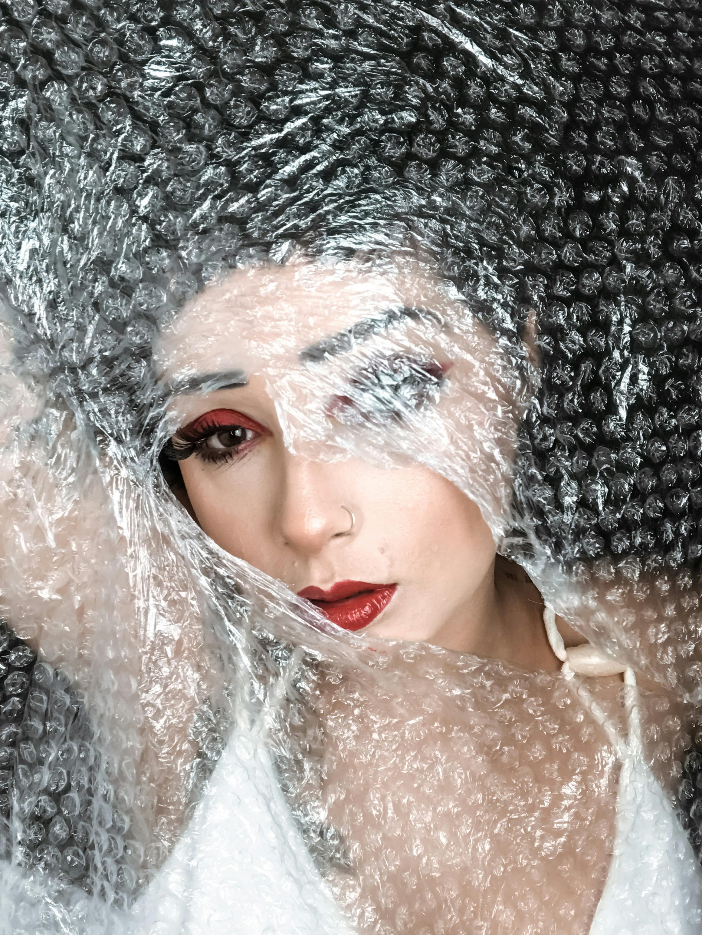 woman under bubble wrap · Free Stock Photo