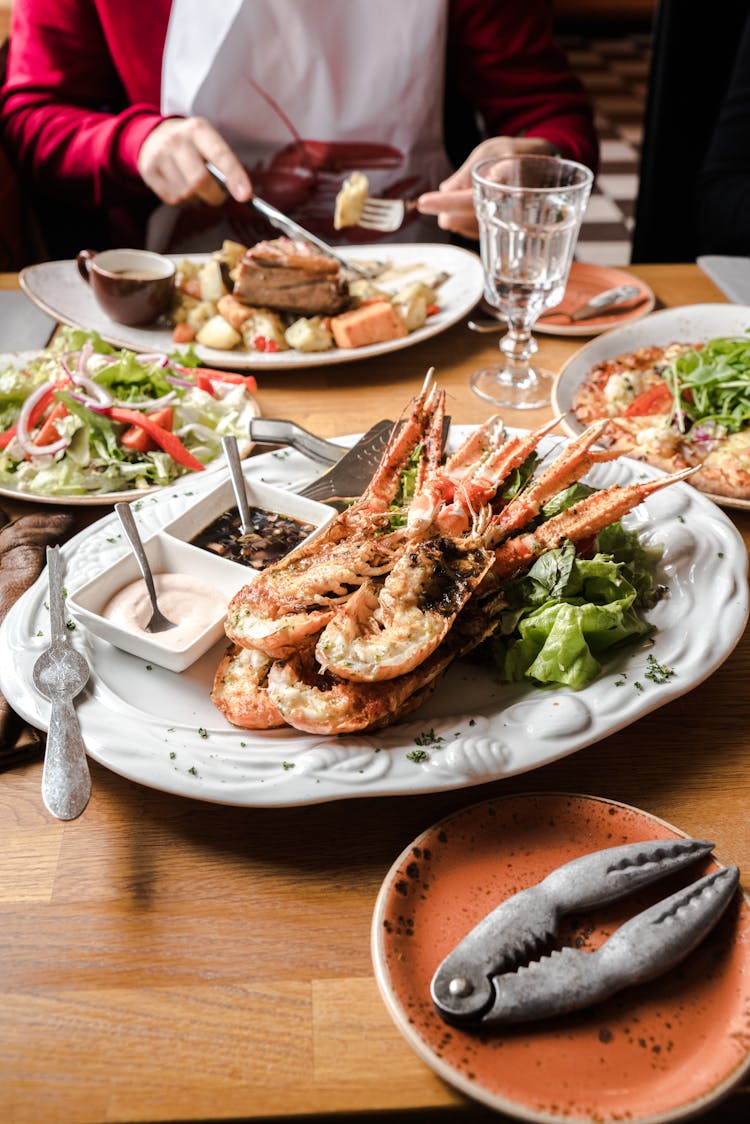 Crop Person Eating Delicious Seafood