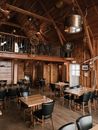 Interior of contemporary restaurant with wooden walls decorated with objects from ancient marine vessels