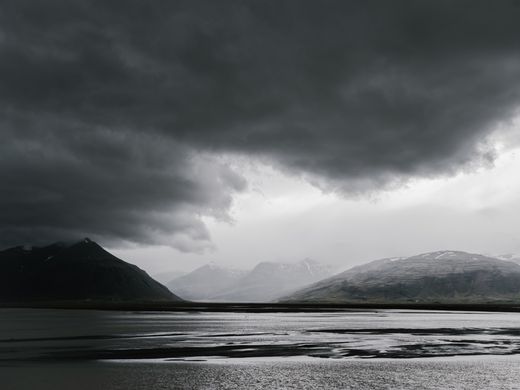 Storm clouds over a mountain lake — photo by ArtHouse Studio on Pexels