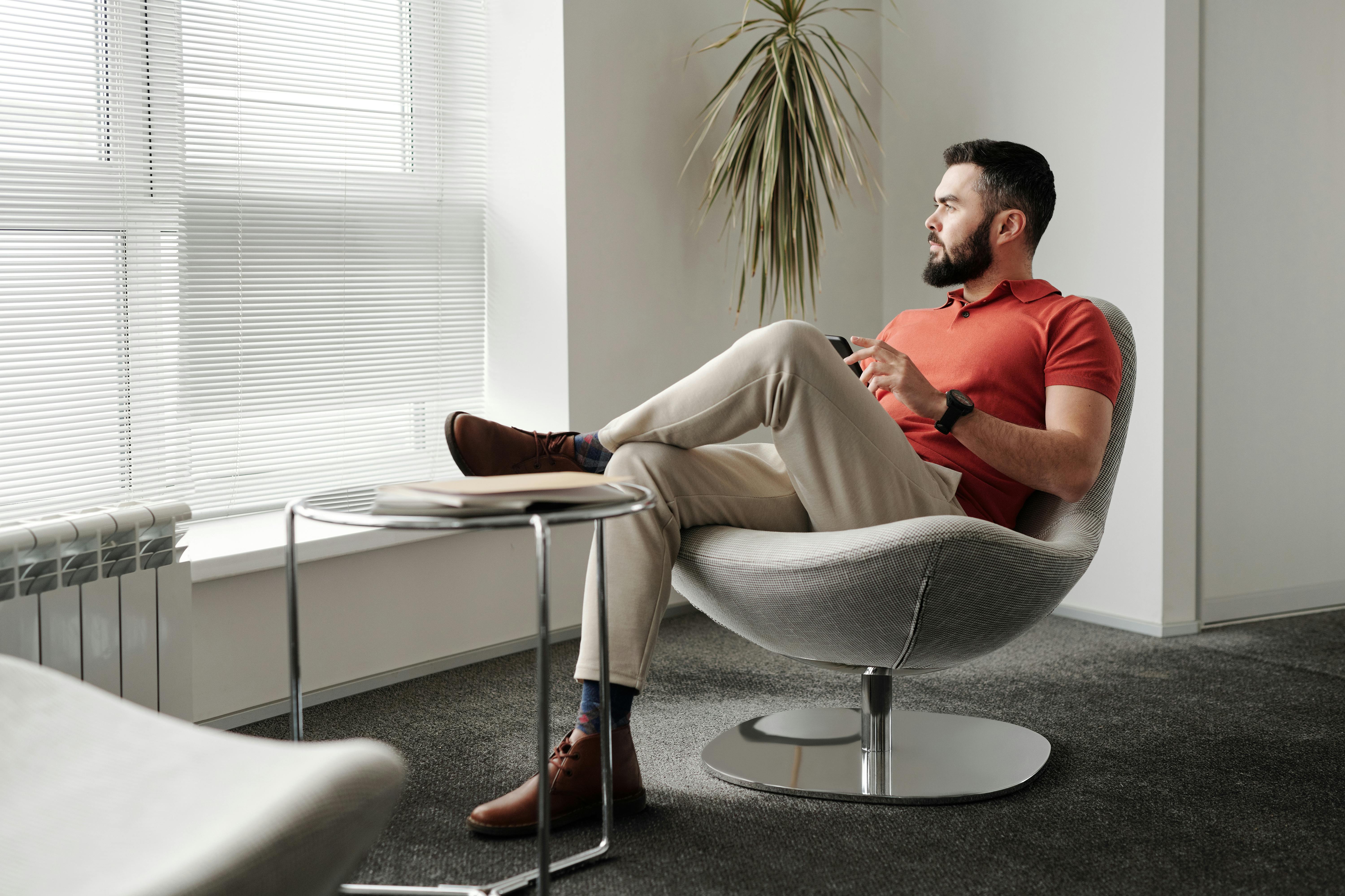 man sitting in a company office