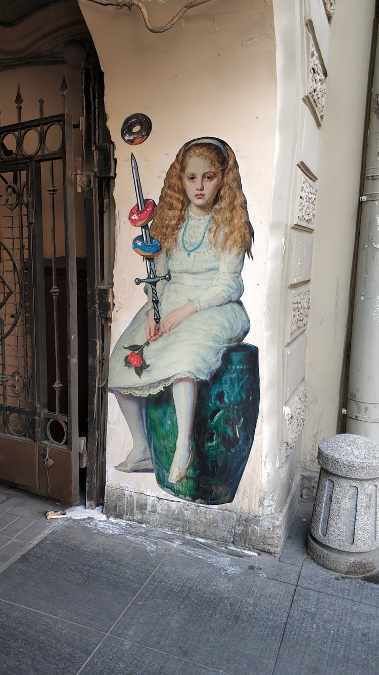 Graffiti Of A Little Girl With A Flower A Sword And Doughnuts