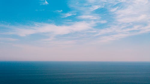 Horizon of calm blue sea in daylight