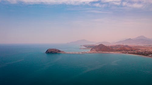 Coastline of settlement near mountain range