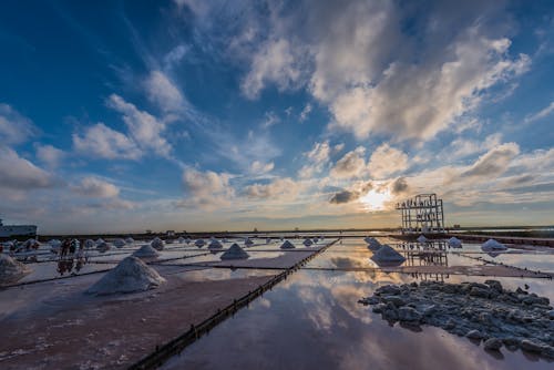 Blue sky above salt fields in evening