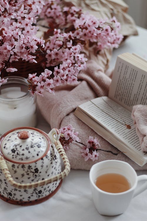 Free Book and cup of tea in cozy room Stock Photo